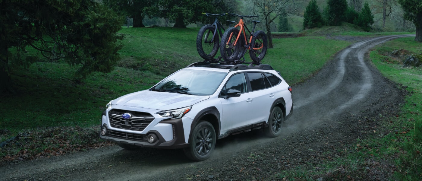 2025 Subaru Outback Exterior On Path With Bikes On Roof