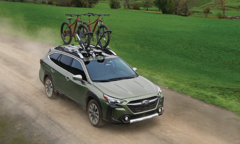 2025 Subaru Outback Exterior On Dirt Road With Bikes
