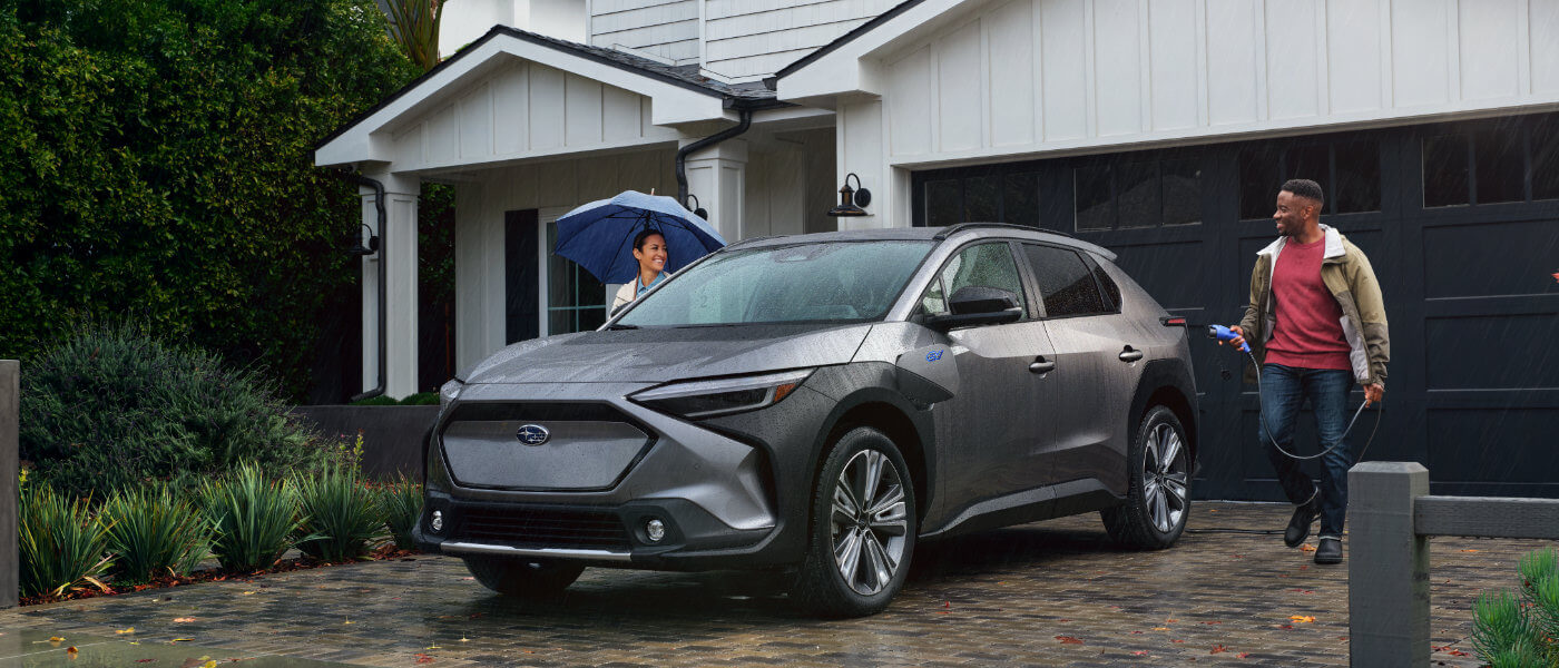 2025 Subaru Solterra Exterior Charging In Driveway