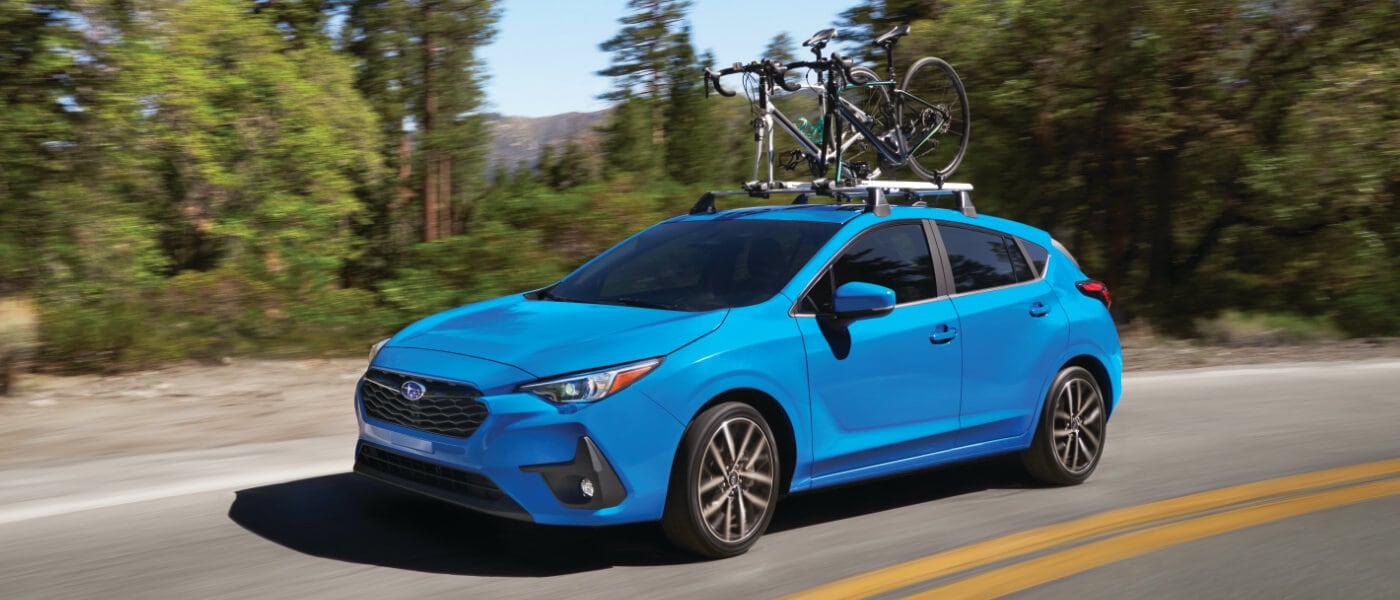 2025 Subaru Impreza Exterior On Turn With Bikes