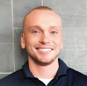 Staff member John Tracey from ID_2d5a5044d1e2