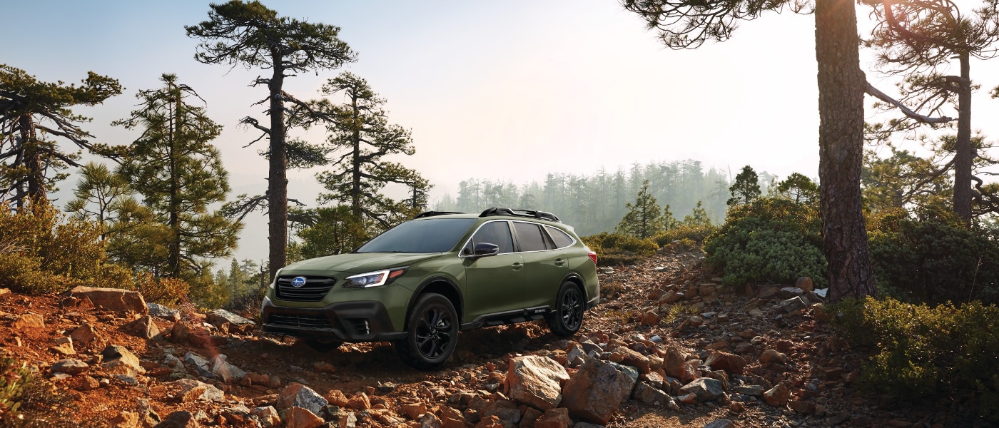 Green 2020 Subaru Outback in forest