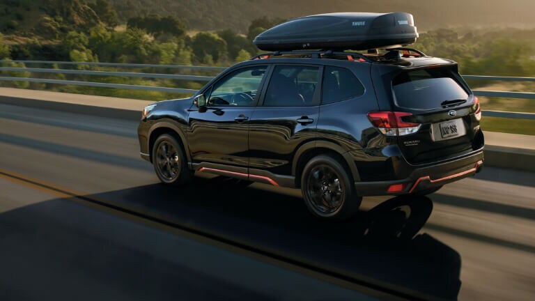 2020 Subaru Forester in black driving on highway