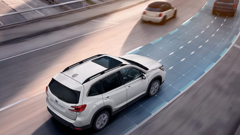 2020 Subaru in white driving on highway showing sensors