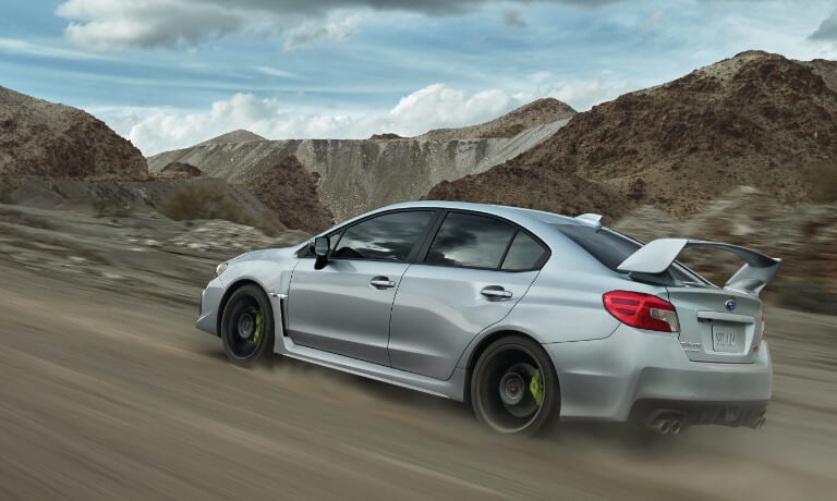 2020 WRX in silver driving on on dirt road