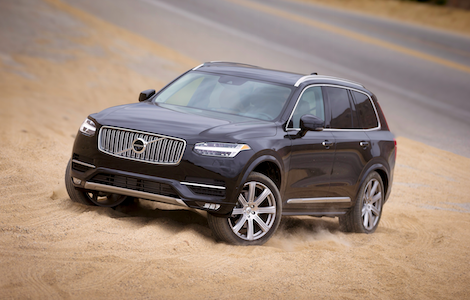 Black Volvo XC90 A black Volvo XC90 driving through the sand