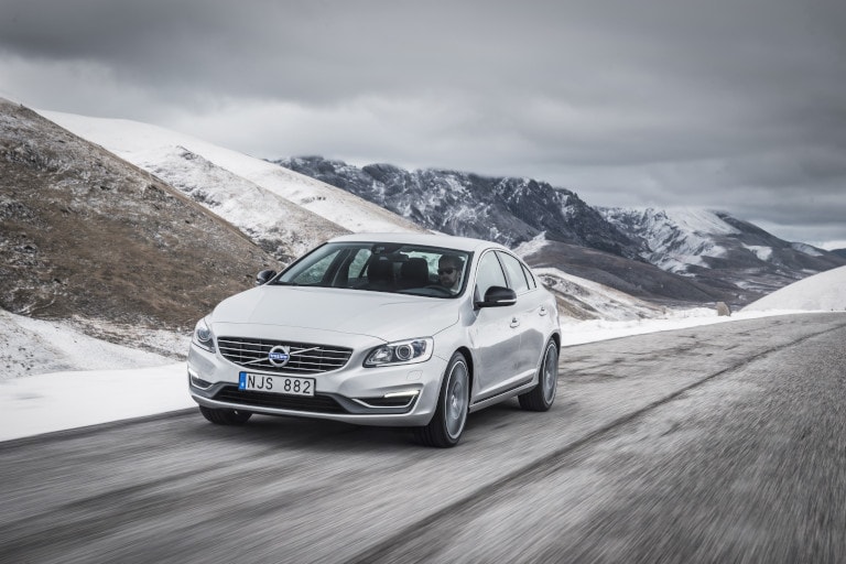 2017 Volvo S60 in front of snowy mountains