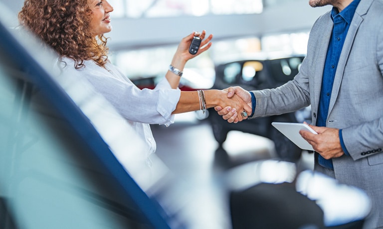 A businessman purchasing a car