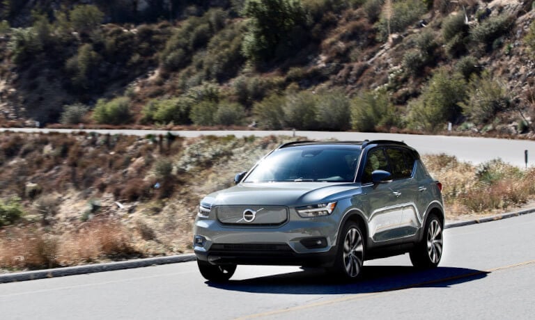 Volvo XC40 Recharge driving on a mountain road