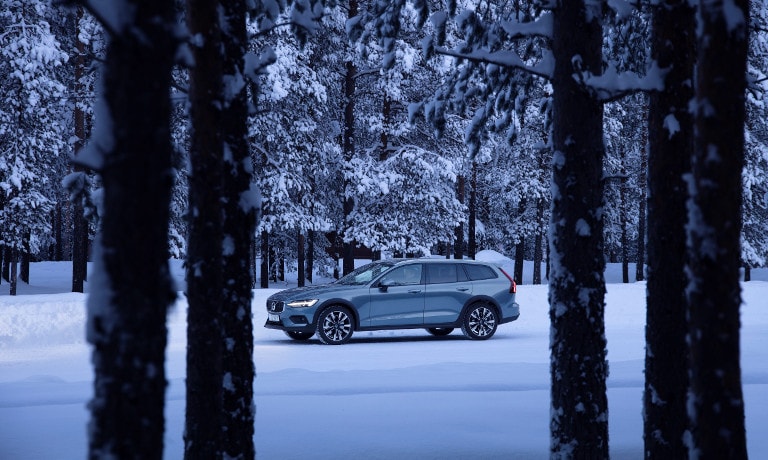 Grey Volvo V60 Cross Country in snow