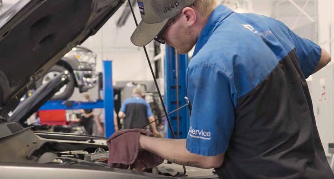 CDJR Service technician servicing vehicle
