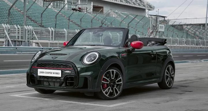 The JCW MINI Convertible zooming on the racetrack.