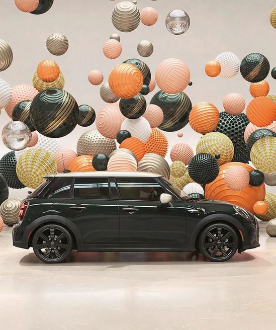 Side view of a MINI Resolute Edition, in a CGI world filled with floating, multi color and multi texture balls.