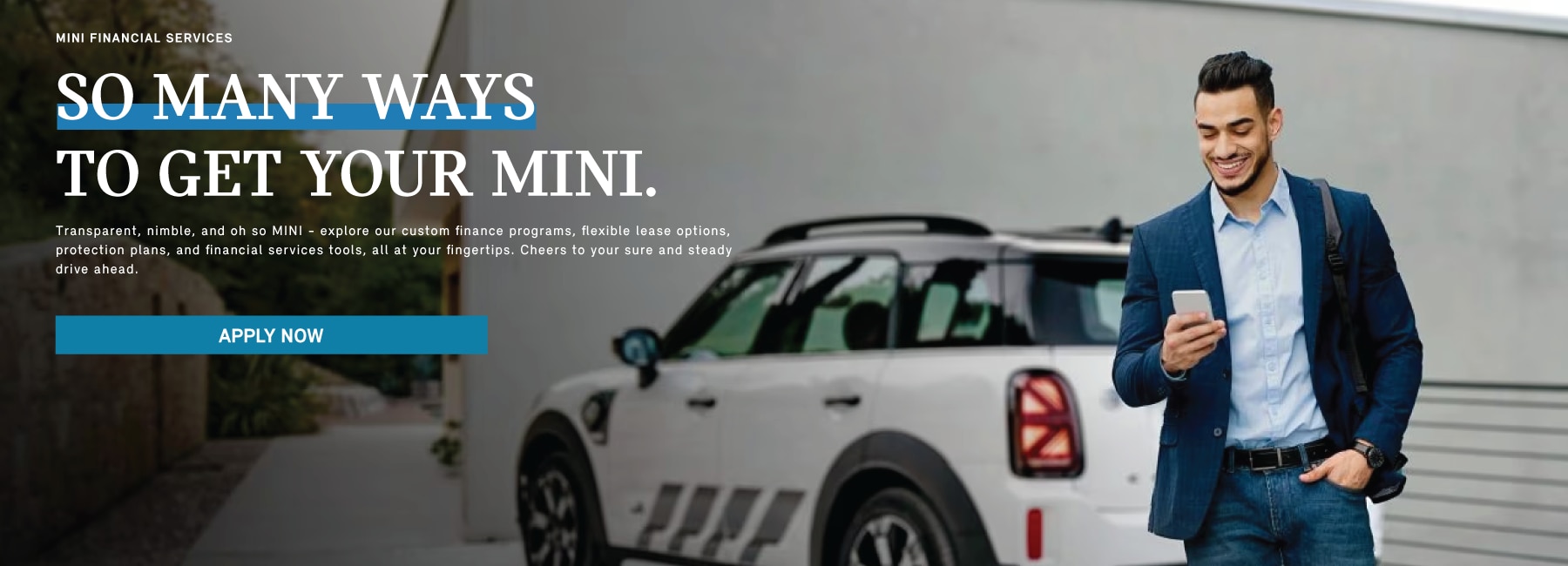A man walks away from his parked MINI while on the phone