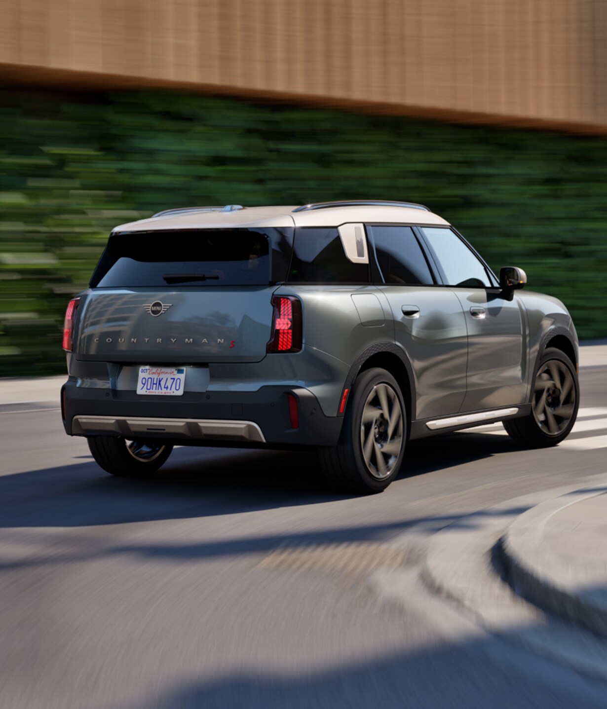 The MINI Countryman S ALL4 cruises down a street.