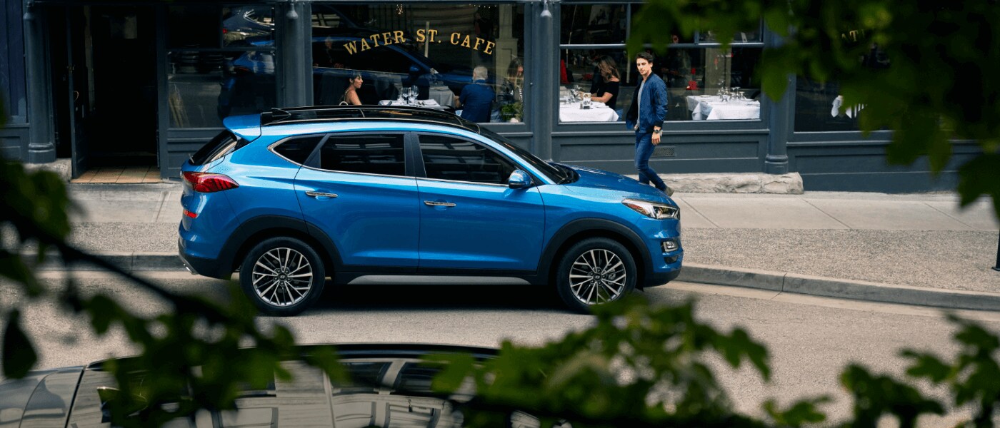 2021 Blue Hyundai Tucson Parked in Front of a Cafe