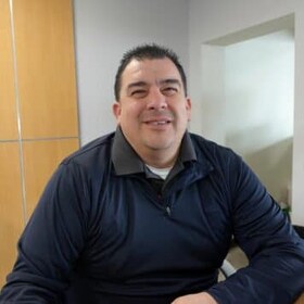 Staff member Dennis Gallegos from a187c9082caa