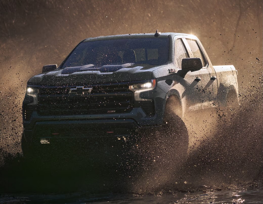  Person cheerfully signing documents.