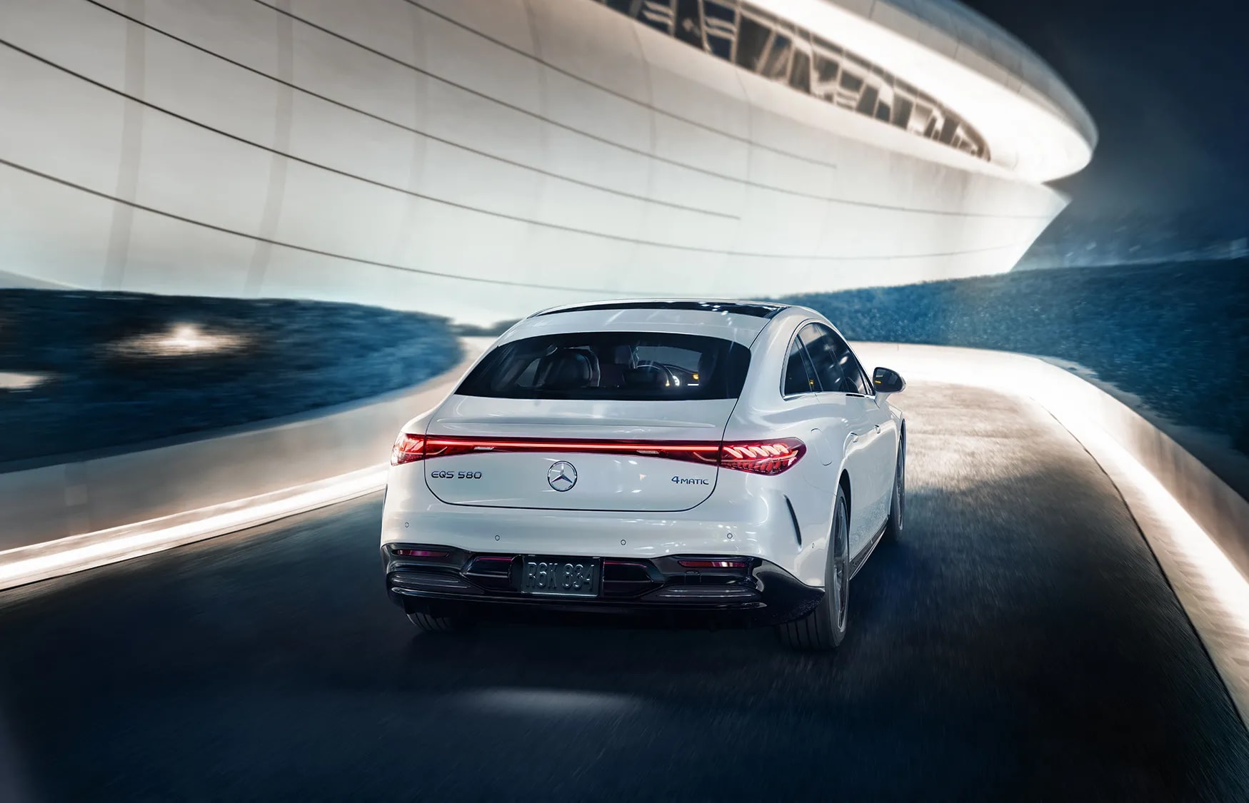 2026 Mercedes-Benz EQS sedan in white finish, crusing