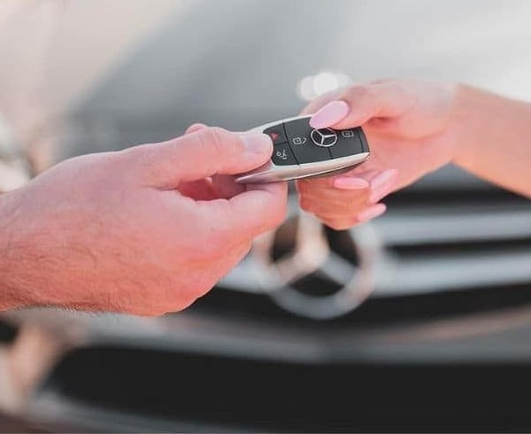 Money being exchanged at a dealership