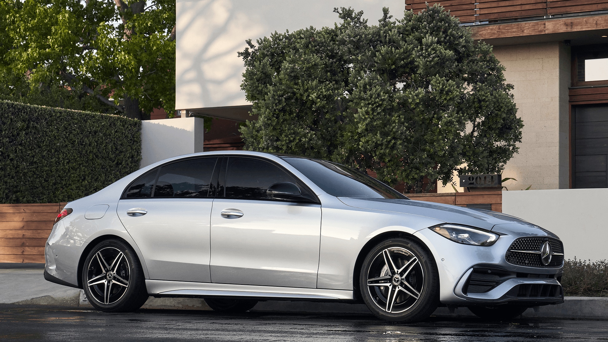 Mercedes-Benz C-Class Sedan parked outside a residence