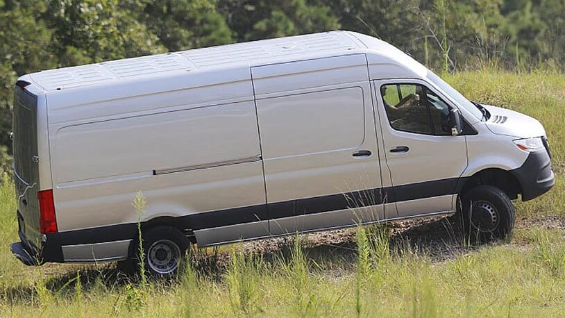 Learn about the specs, configurations, and color options of the Mercedes-Benz Sprinter Cargo Van Exterior shot of a Mercedes-Benz Sprinter Cargo Van traveling off-road