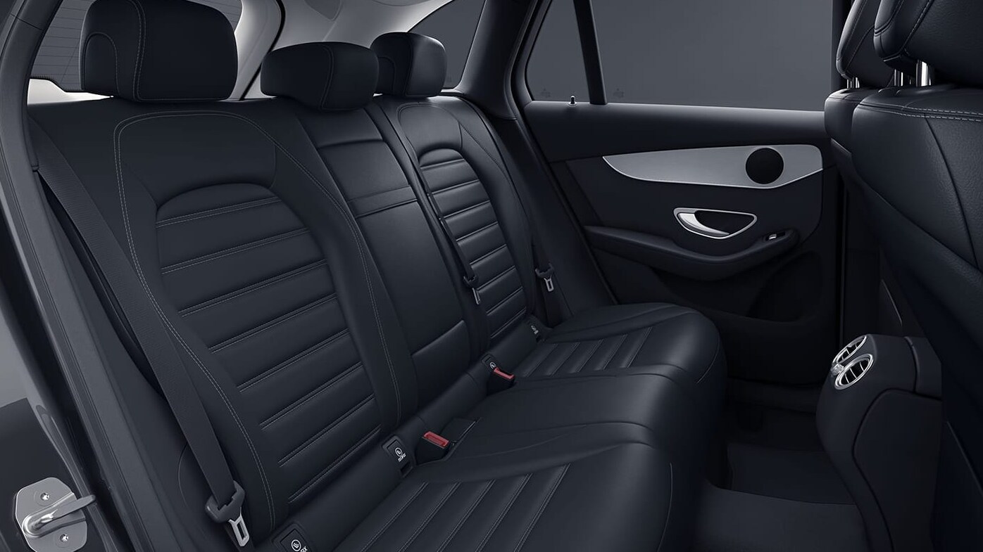 A view of the back seat upholstered in black material and contrasting white stitching of a 2022 Mercedes-Benz GLC.