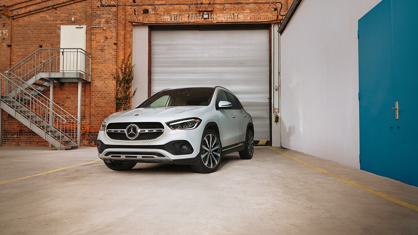 A-white-2023-Mercedes-Benz-GLA-4MATIC-sits-parked-in-a-driveway