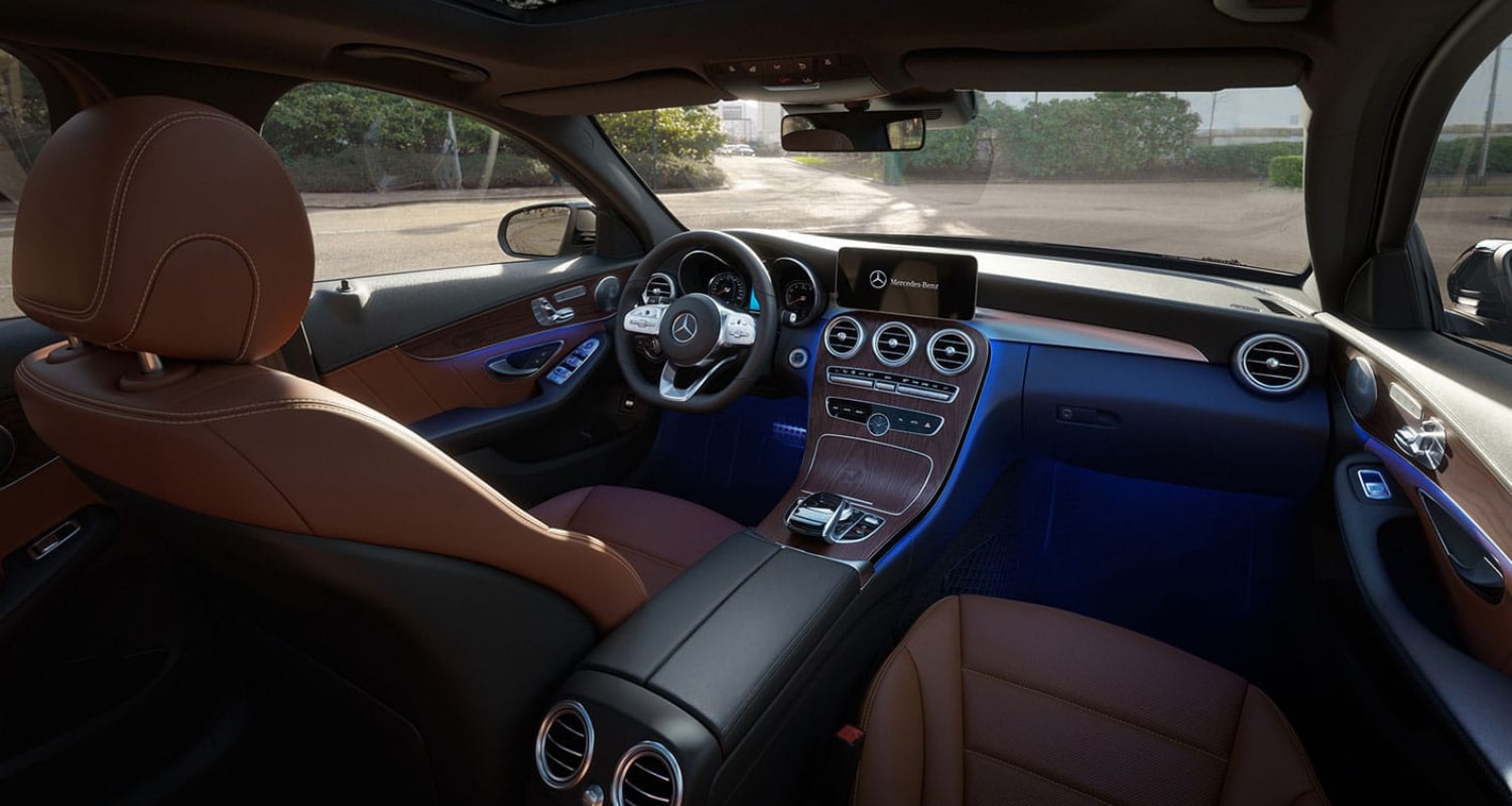 New interior design inside the 2021 Mercedes-Benz C-Class sedan showing upscale features and classy ambient lighting
