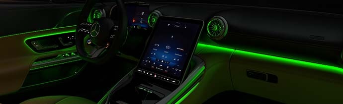 A sleek Mercedes-AMG high-performance sedan on a scenic Colorado road.