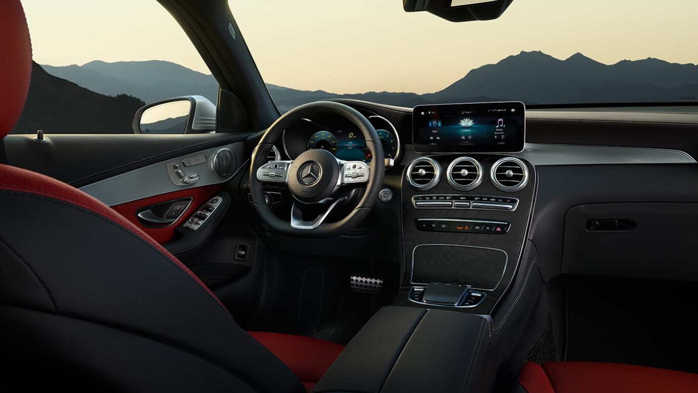 A view of the dash of a black and red interior of a 2022 Mercedes-Benz GLC
