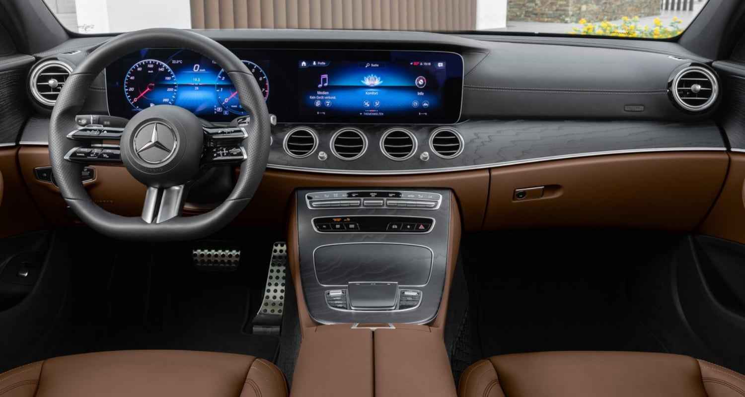 Luxurious front interior design of the new 2021 Mercedes-Benz E-Class Sedan as seen from the back seat