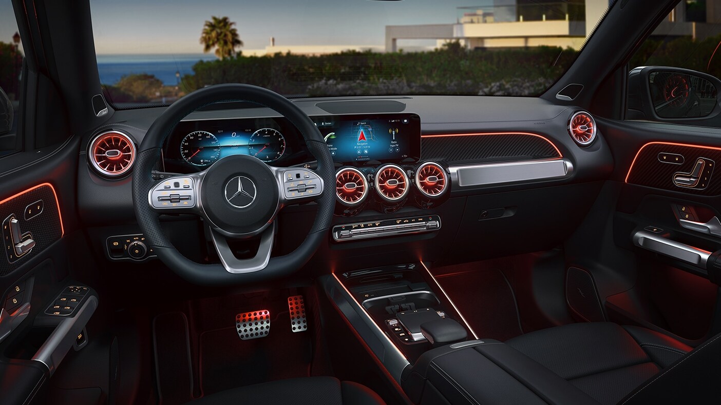 The interior of a Mercedes-Benz GLB displaying the infotainment system, dashboard, and luxury features of the interior