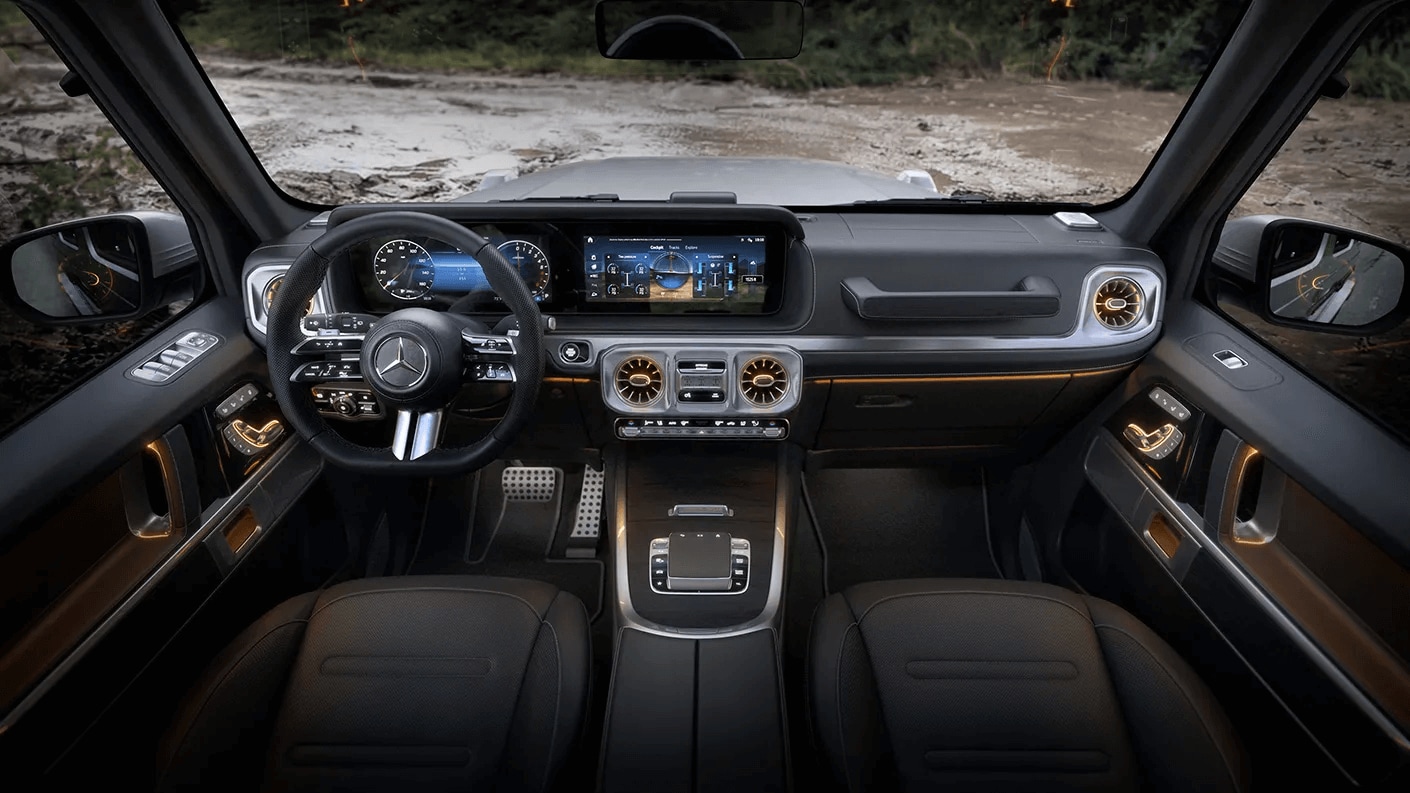 Rendered image of the front row of the Mercedes-Benz G-Class SUV showing the steering wheel and dashboard console