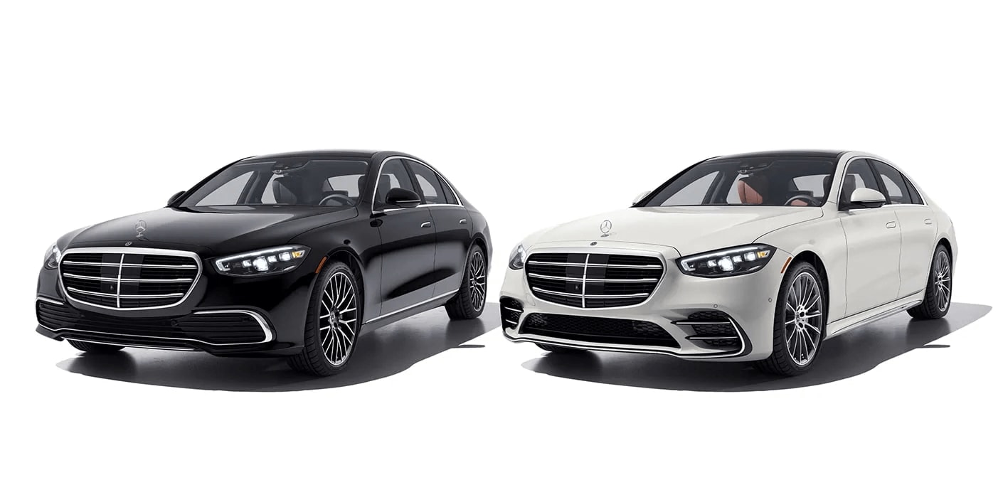 A black Mercedes-Benz S-Class and a white Mercedes-Benz S-Class parked side by side