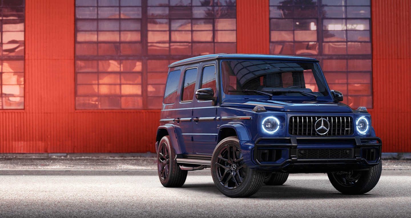 Mercedes-Benz G-Class luxury SUV parked outside a building