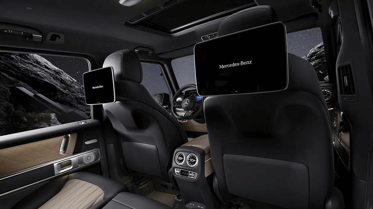 Learn about the seating and cargo capacity of the Mercedes-Benz GLA SUV Rendered image of the second row seats of the Mercedes-Benz G-Class SUV with available MBUX high-end rear seat entertainment system