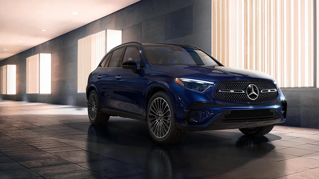 Shop 2024 Mercedes-Benz GLC 300 SUV at Mercedes-Benz of Sarasota Blue Mercedes-Benz GLC 300 SUV parked in a rendered showroom