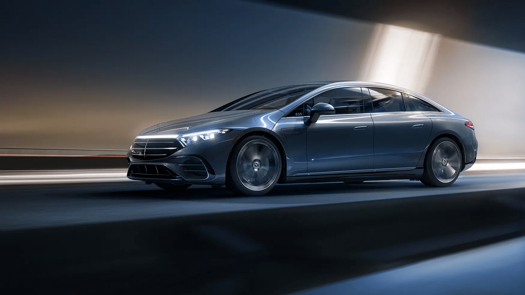 Rendered image of a Mercedes-Benz EQS Sedan driving down a road