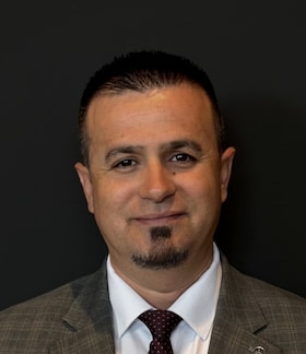 Staff member Tony Xhelo from ID_aa2fe8d34a9e