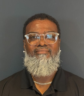 Staff member Ernest Carpenter  from ID_61833ba2e140