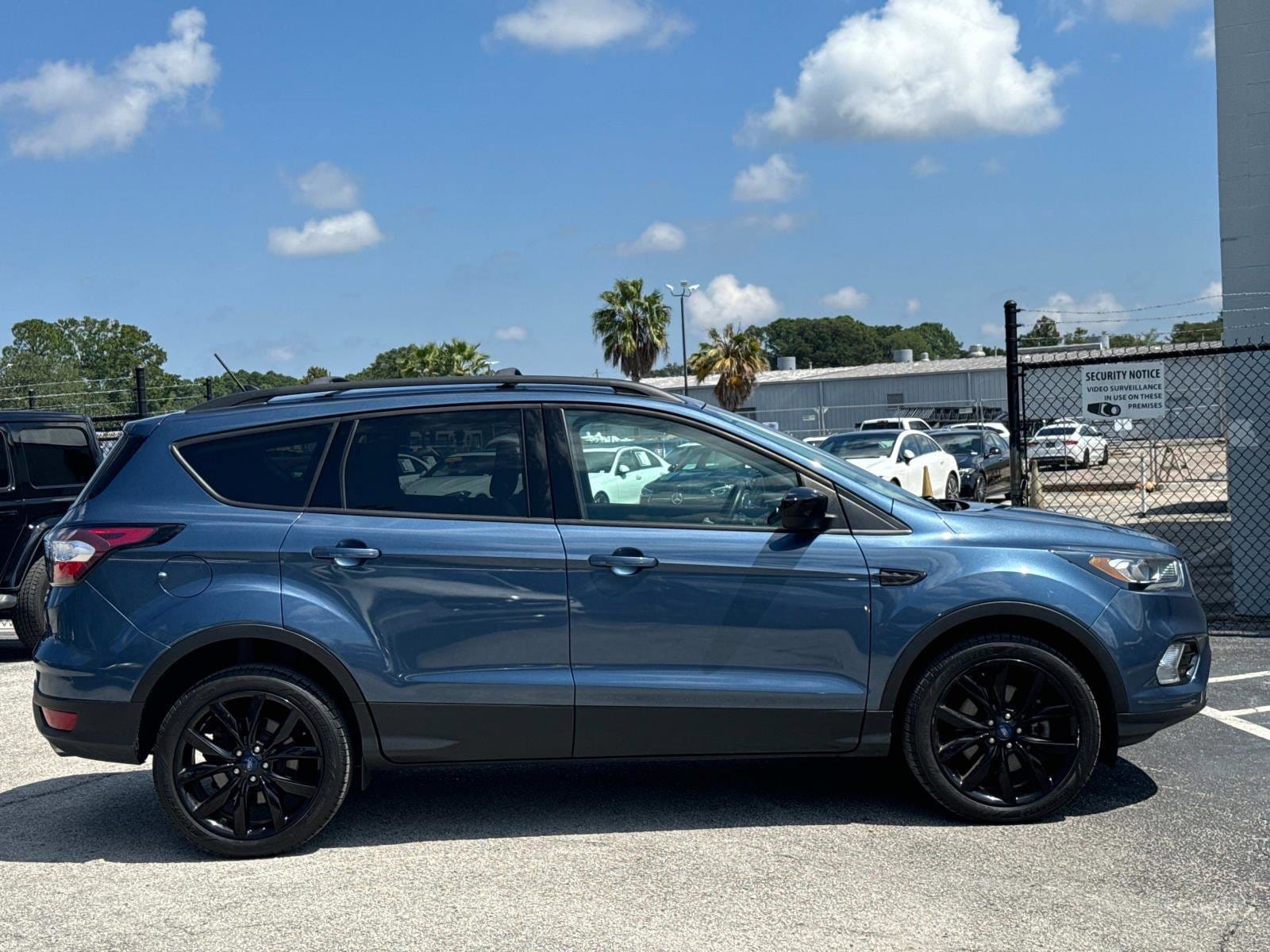 Used 2018 Ford Escape SE with VIN 1FMCU9GD8JUA77591 for sale in Jacksonville, FL