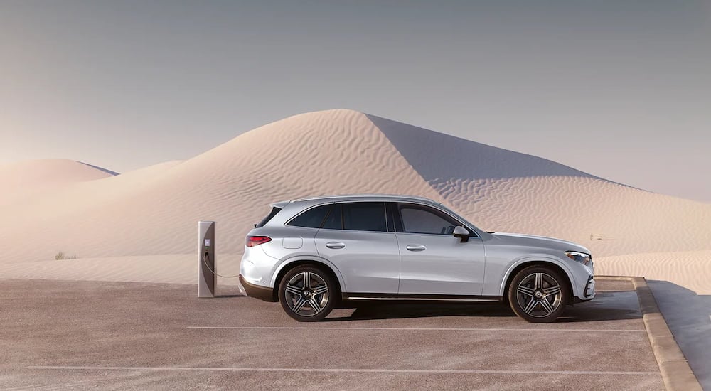 Side angle view of a white 2025 Mercedes-Benz GLC 300 angled right.