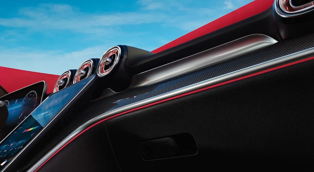 Lines of red ambient lighting in the cabin of a 2023 Mercedes-Benz C 300.