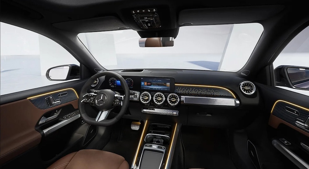 The black and gold interior of a 2025 Mercedes-Benz GLB 250 Pinnacle.