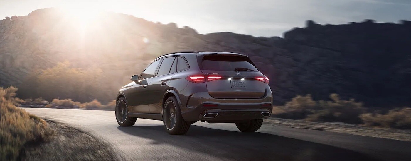 A tan 2024 Mercedes-Benz GLC 300 is shown from the rear at an angle.