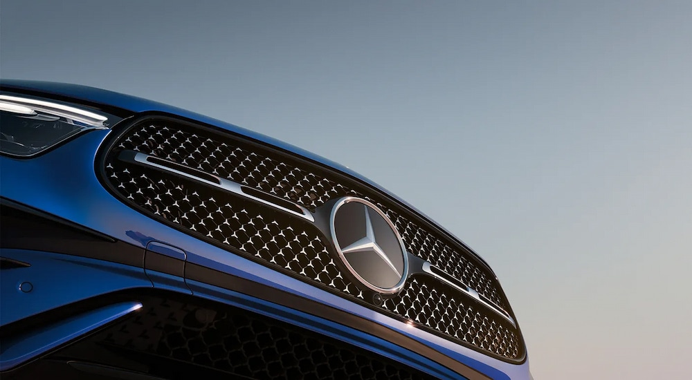 Close-up of the grille on a blue 2025 Mercedes-Benz GLC 300 4MATIC Pinnacle.