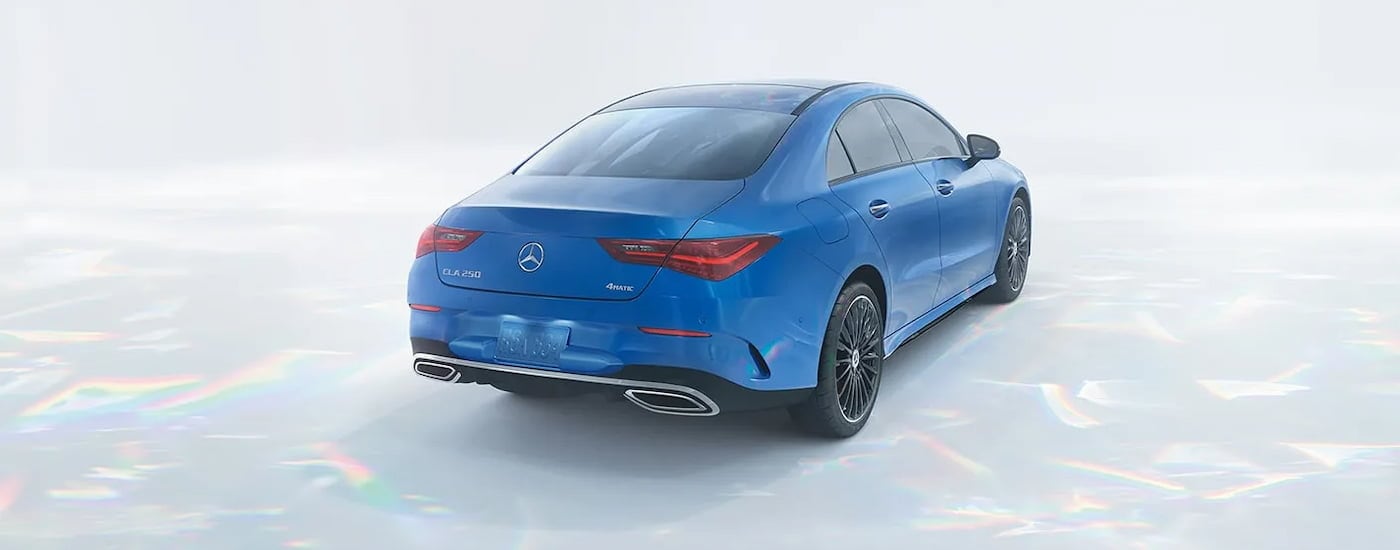 A rear view of a blue 2024 Mercedes-Benz CLA 250 4MATIC.