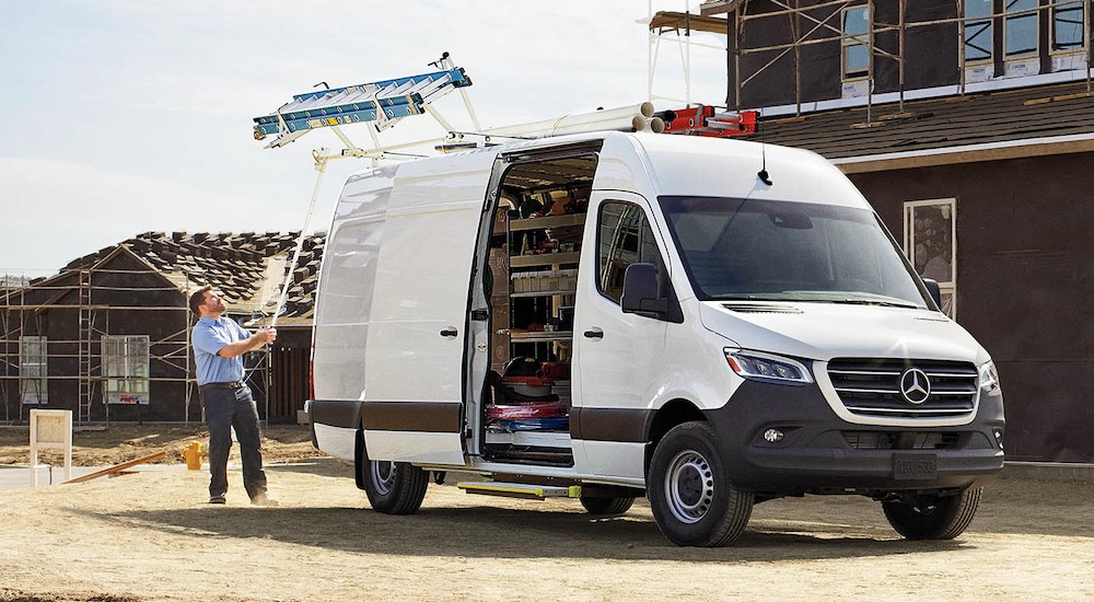 A person is shown unloading a ladder from the roof of a 2024 Mercedes-Benz Sprinter 2500.