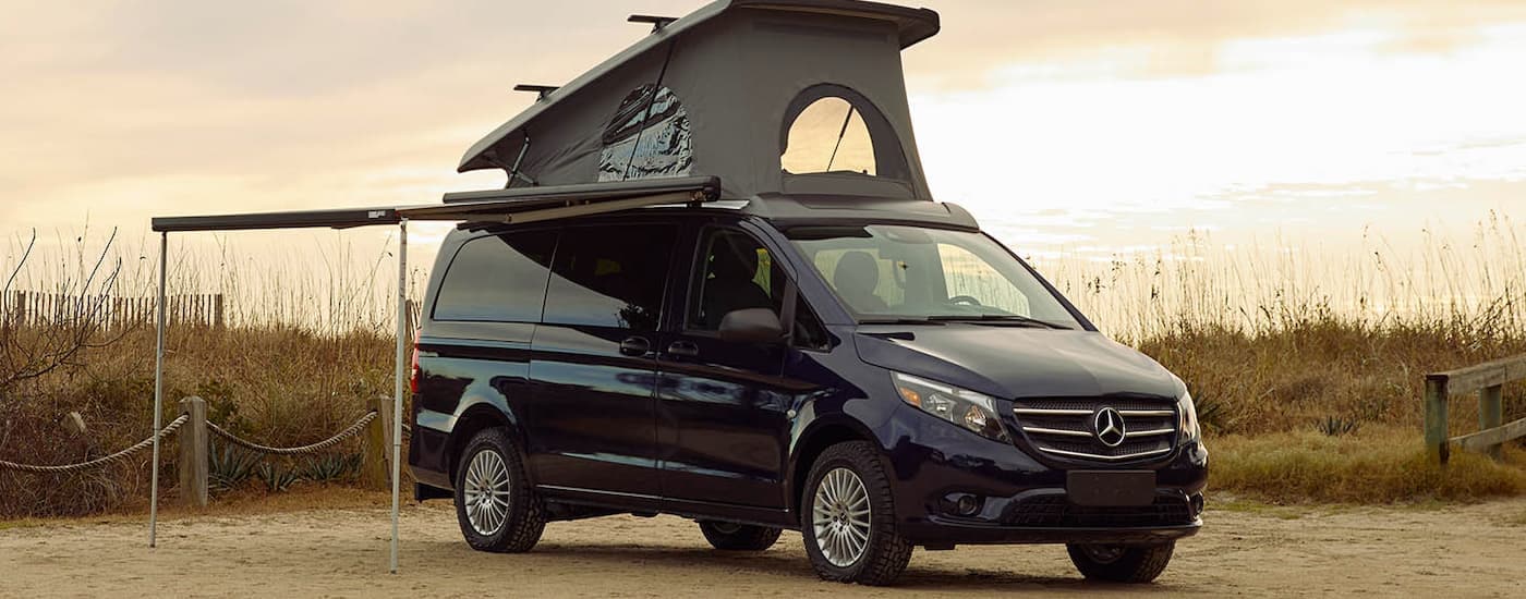 A black 2025 Mercedes-Benz Metris Passenger Van parked and angled right.